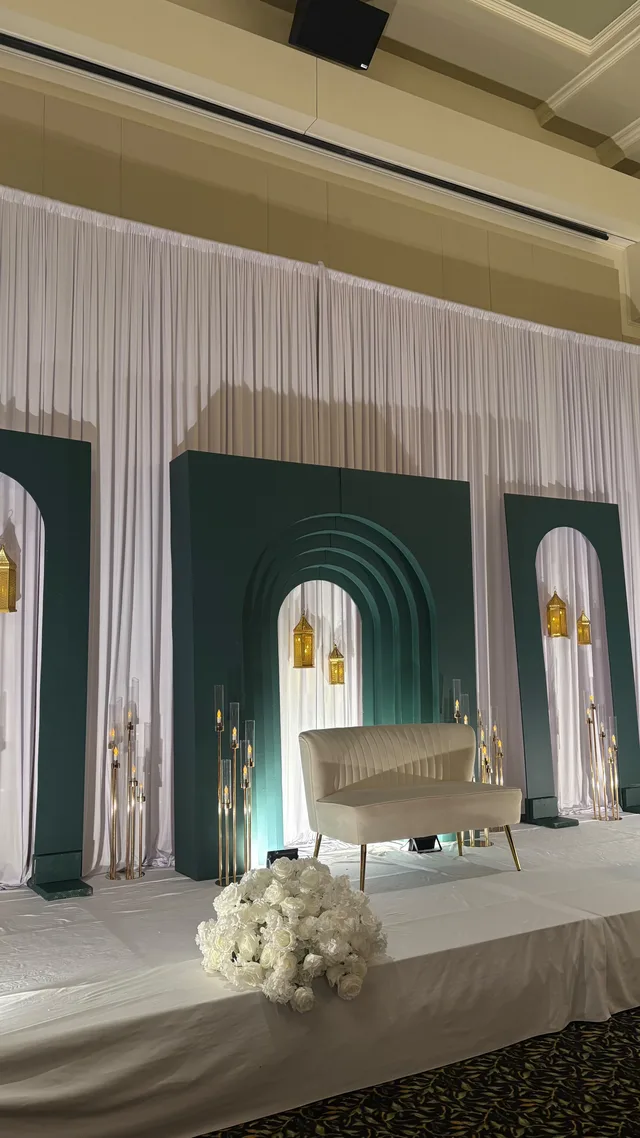 Green arches framing the stage at an MSA gathering