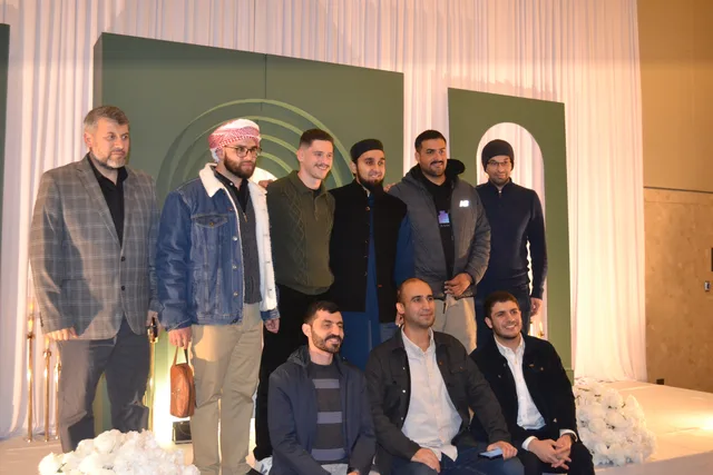 A group gathered together on stage