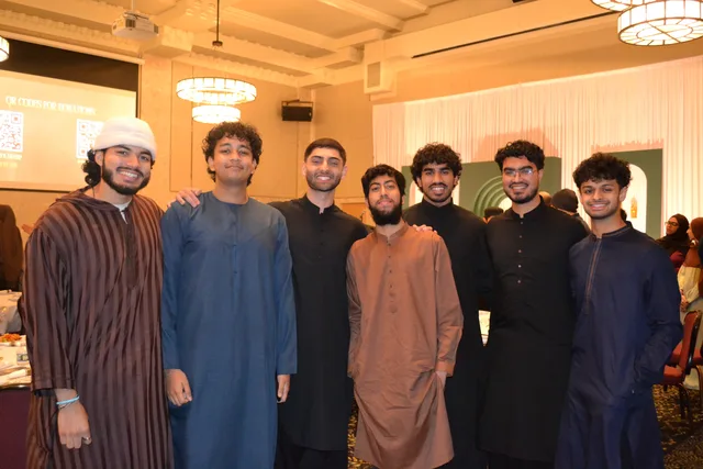Seven attendees posing together