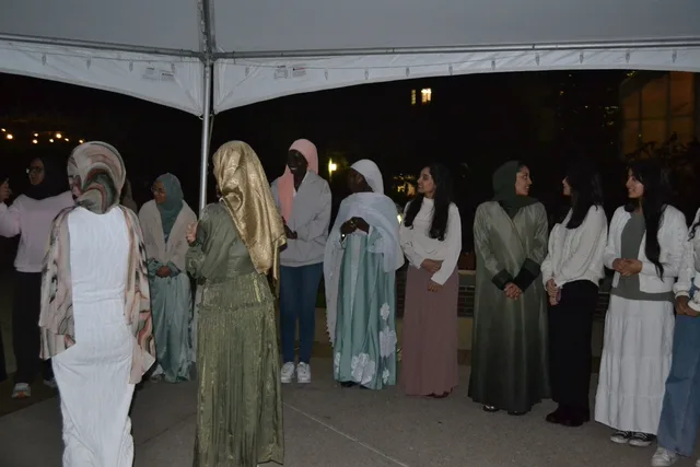 Attendees gathered beneath a tent
