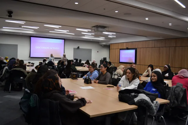 Small-group discussions around classroom tables