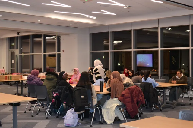 Attendees talking together during a discussion activity