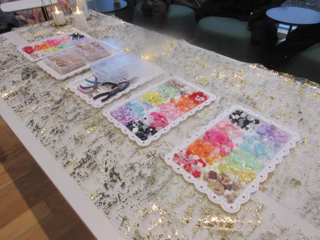 Colorful beads and tools set out for jewelry making