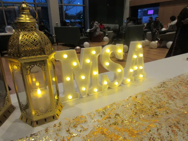 Illuminated MSA letters beside a gold lantern