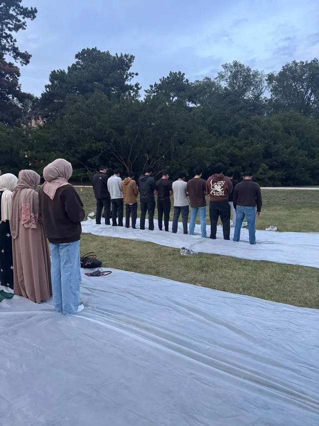 Congregational prayer outdoors on campus